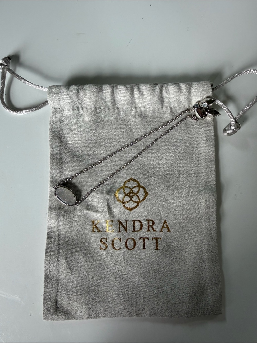 Necklace on branded pouch